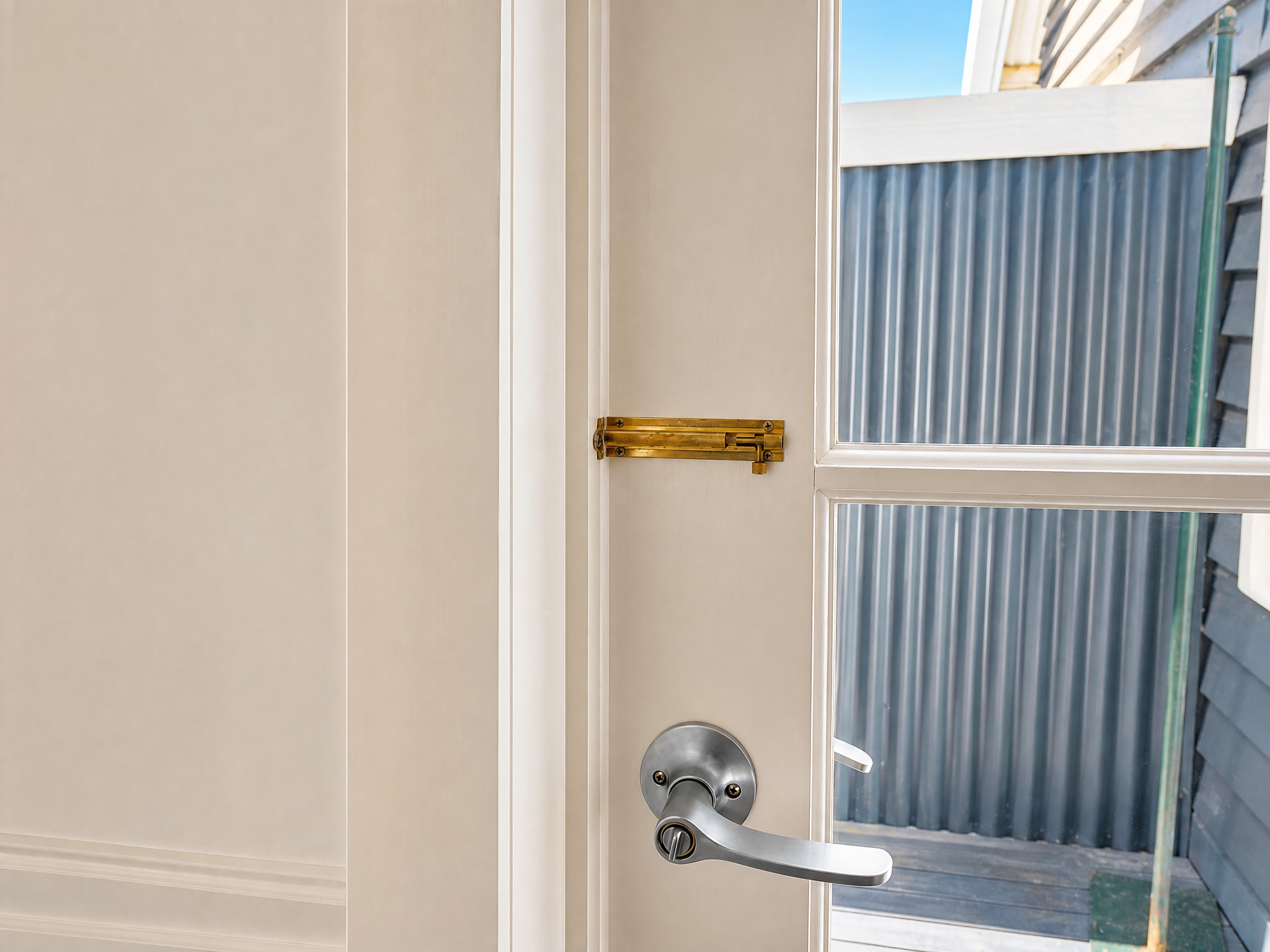 Rear door and laundry access at Little Anchorage