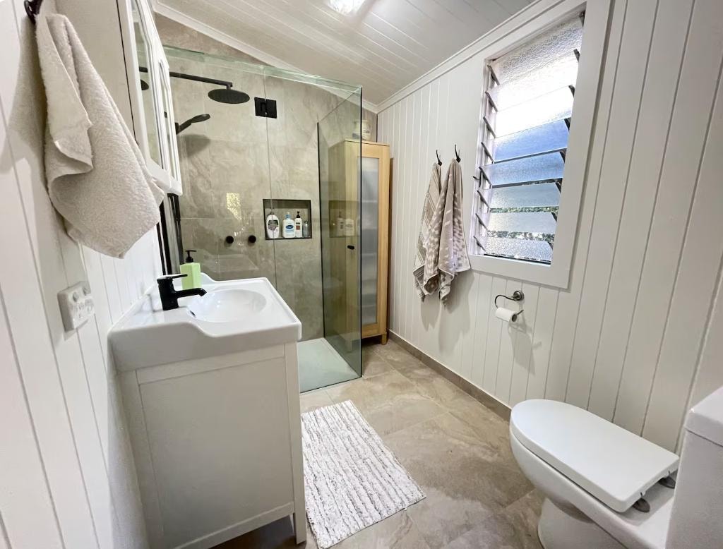 Bathroom — rain shower and white vanity, Little Anchorage