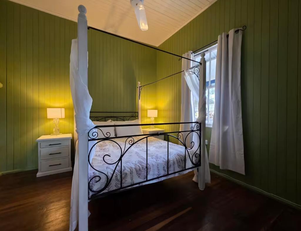 Main bedroom — queen four-poster bed, Little Anchorage