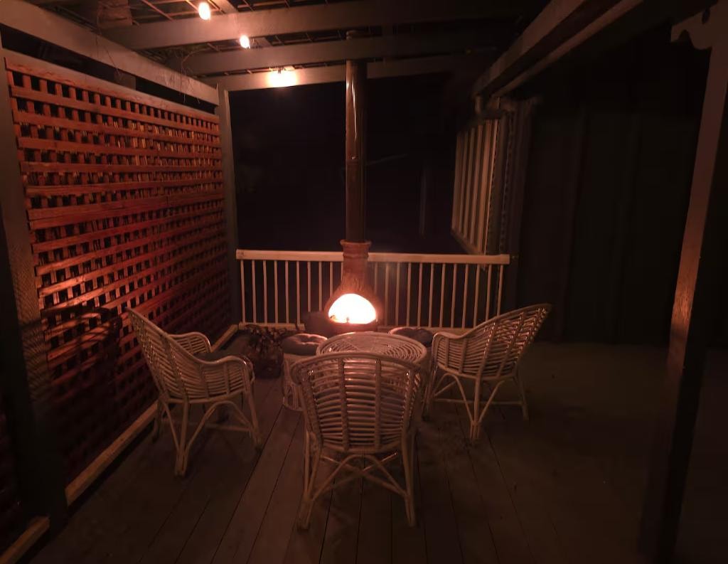 Side deck with chiminea and rattan seating, Little Anchorage